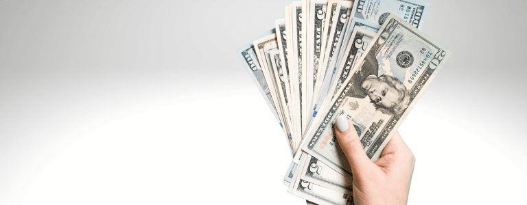 hand holding cash from HVAC system rebate